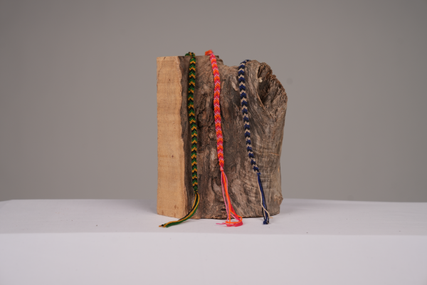 three bracelets on log
